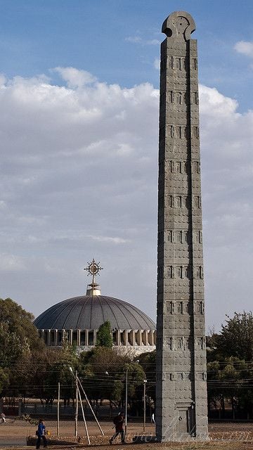 Ancient Axum obelisk with church of Mary of Zion behind