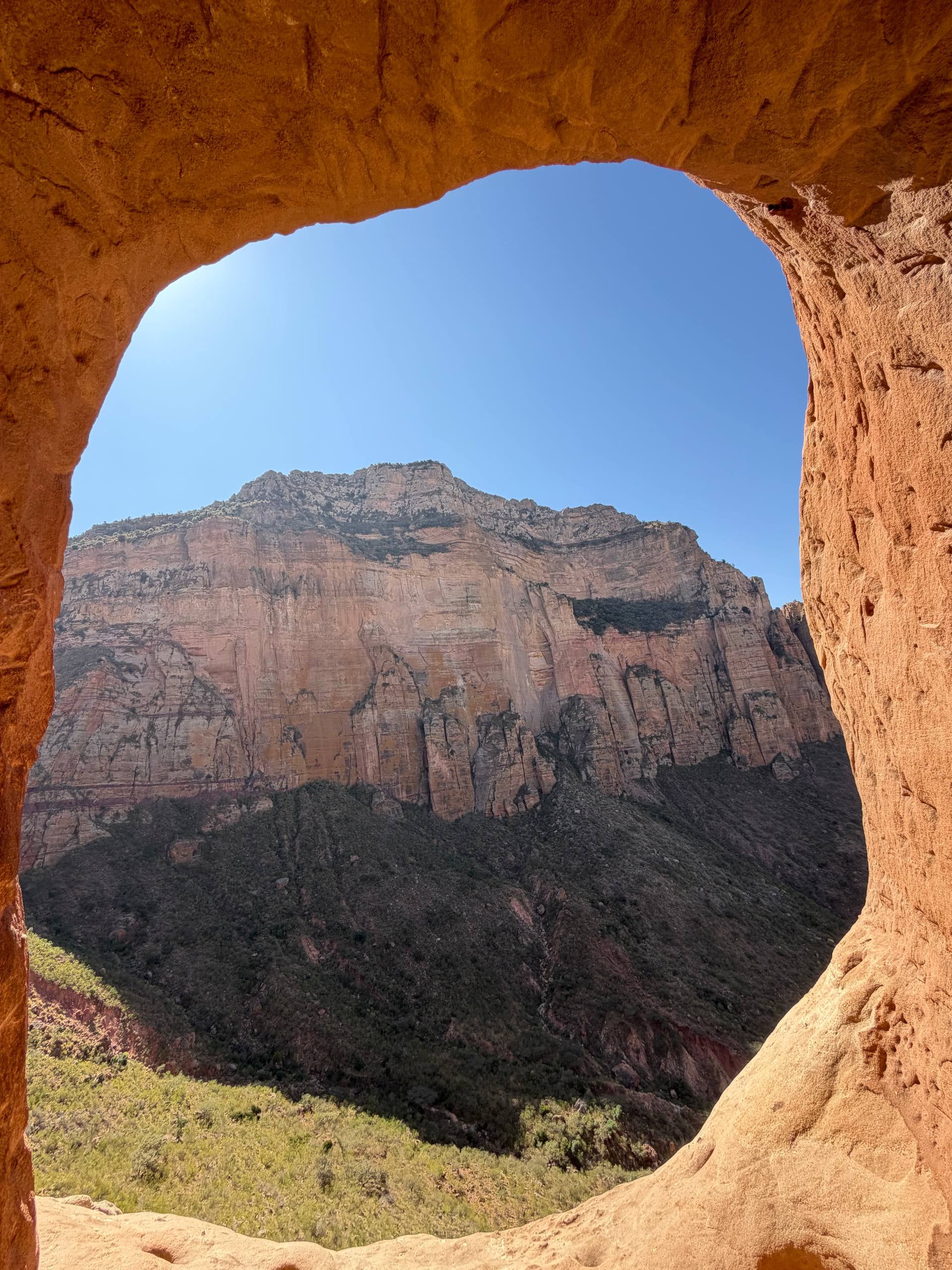 Rock arch at Sof Omar Caves framing the cliff face